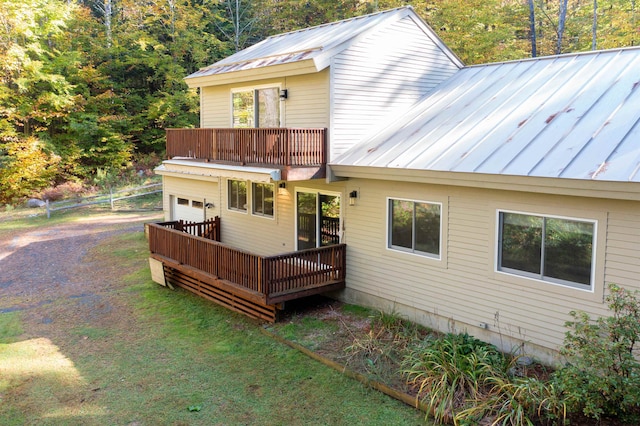 back of house featuring a deck