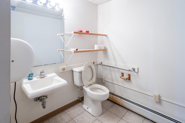 bathroom featuring sink, tile patterned flooring, toilet, and a baseboard heating unit