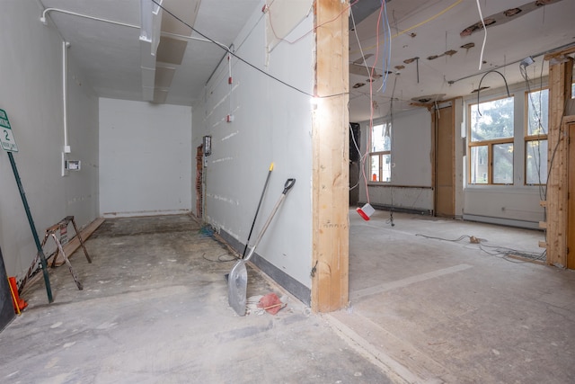 basement with a baseboard heating unit