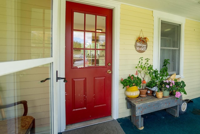 property entrance with covered porch