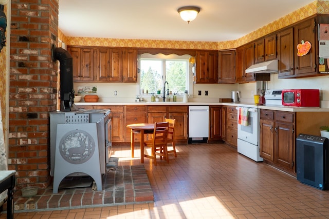 kitchen featuring sink and white appliances