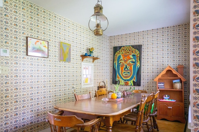 dining space featuring wood-type flooring