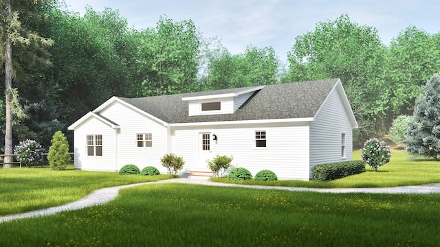 view of front of property featuring a shingled roof and a front lawn