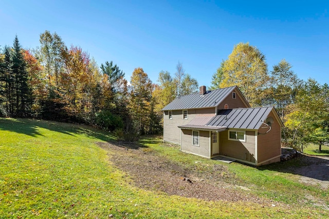 view of property exterior with a yard