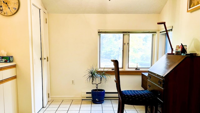 misc room featuring light tile patterned flooring, baseboard heating, and a textured ceiling