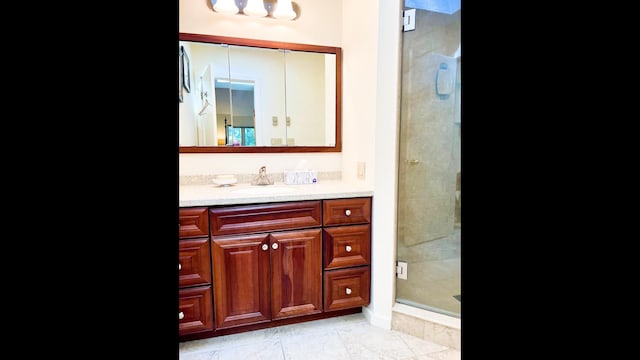 bathroom with walk in shower, tile patterned floors, and vanity