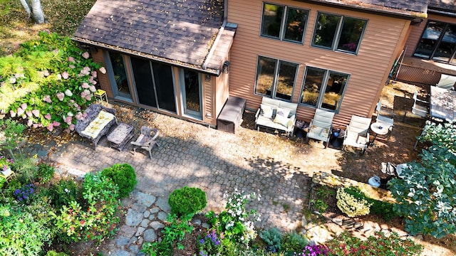 rear view of house featuring a patio