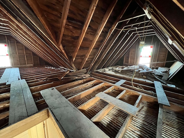 unfinished attic featuring plenty of natural light