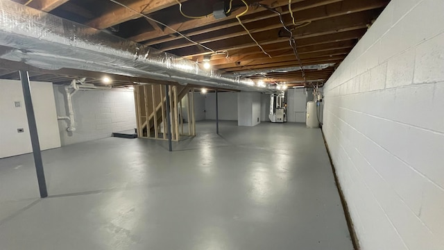 basement with water heater and heating unit