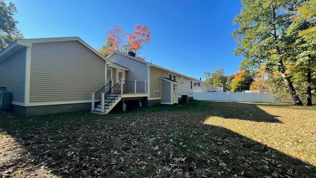 view of side of property with a yard