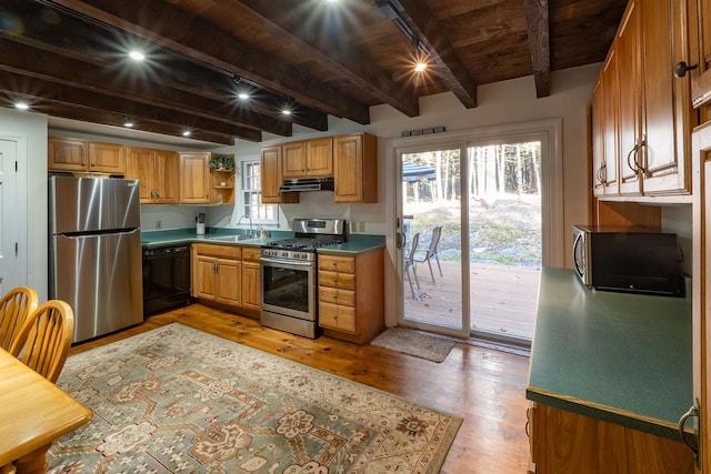 kitchen with beam ceiling, light hardwood / wood-style flooring, wood ceiling, sink, and appliances with stainless steel finishes