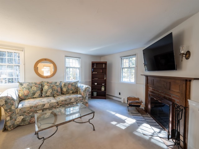 living room featuring a brick fireplace, a baseboard radiator, and carpet flooring