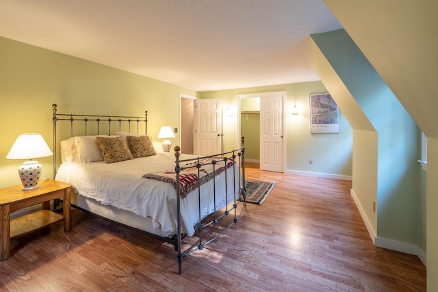 bedroom with hardwood / wood-style floors