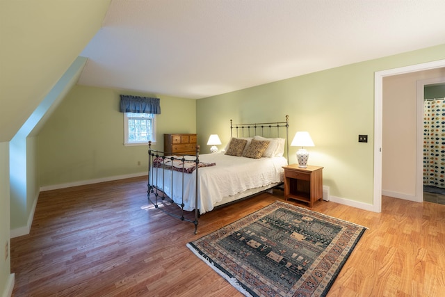 bedroom with hardwood / wood-style floors