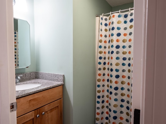 bathroom with vanity and a shower with curtain