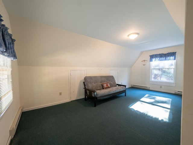 bonus room featuring vaulted ceiling, dark carpet, a baseboard radiator, and a healthy amount of sunlight