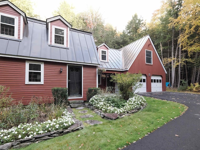 view of front facade with a garage and a front lawn