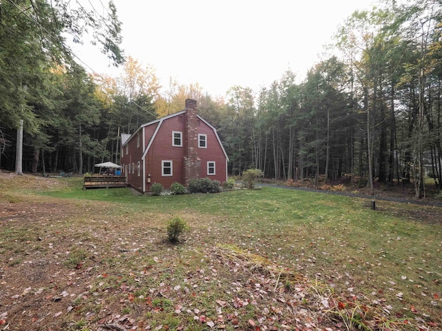 view of yard featuring a wooden deck