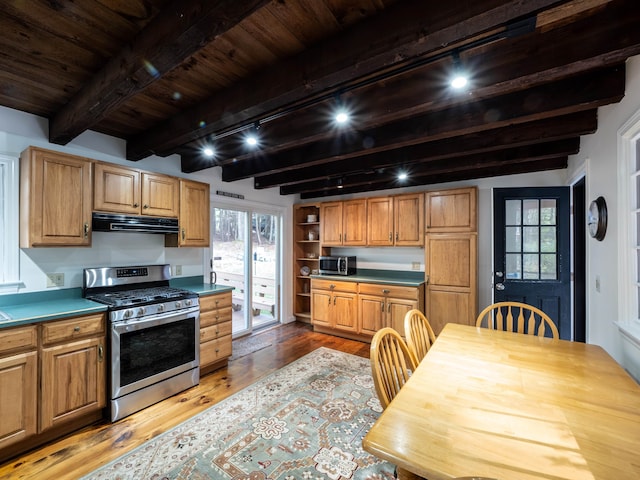 kitchen featuring wood-type flooring, wooden ceiling, track lighting, appliances with stainless steel finishes, and beam ceiling