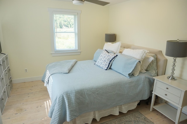 bedroom featuring ceiling fan and light hardwood / wood-style flooring