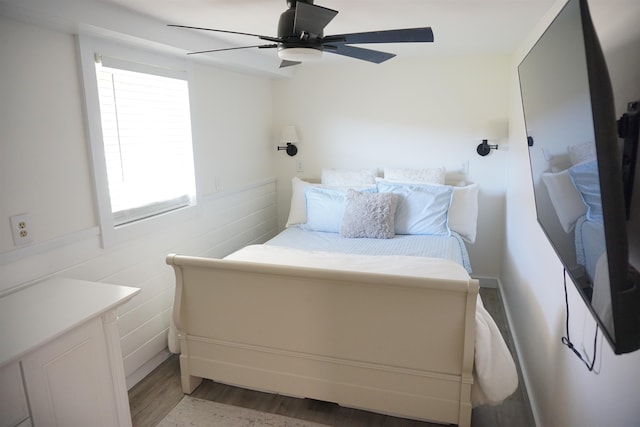 bedroom featuring ceiling fan and light hardwood / wood-style flooring