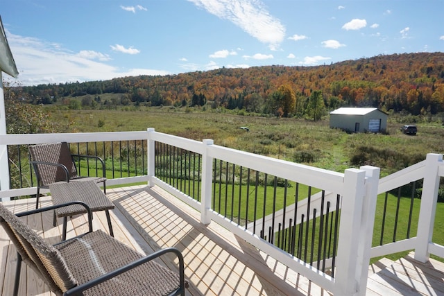 wooden terrace with a yard