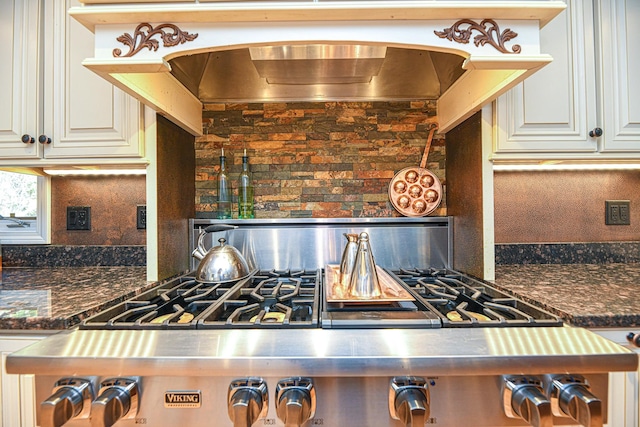 kitchen with extractor fan and stainless steel range oven