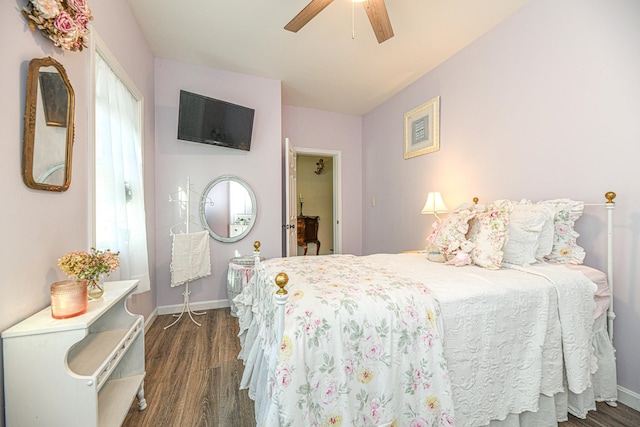 bedroom featuring ceiling fan and dark wood-type flooring