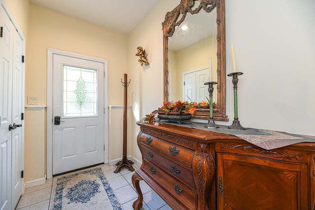 foyer entrance featuring light tile patterned floors