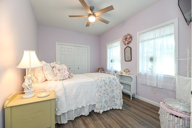 bedroom featuring ceiling fan, a closet, and dark hardwood / wood-style floors