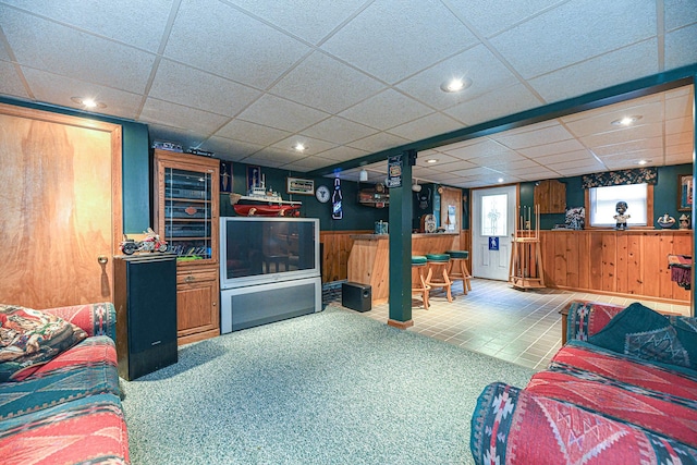 living room featuring a drop ceiling