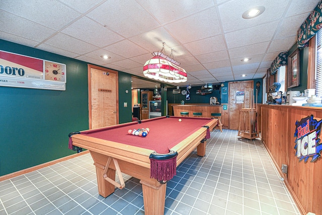 game room featuring a paneled ceiling, tile patterned flooring, and billiards