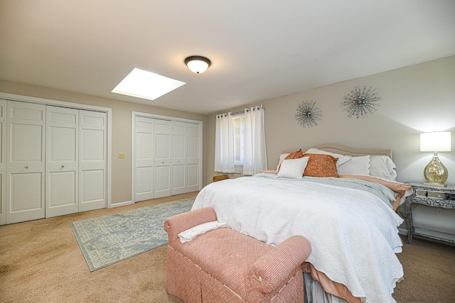 carpeted bedroom with two closets