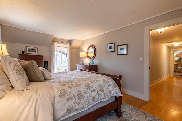 bedroom with hardwood / wood-style floors