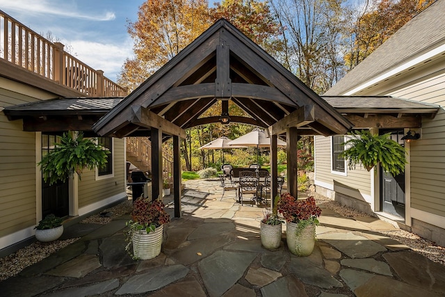 view of patio featuring a gazebo and a grill