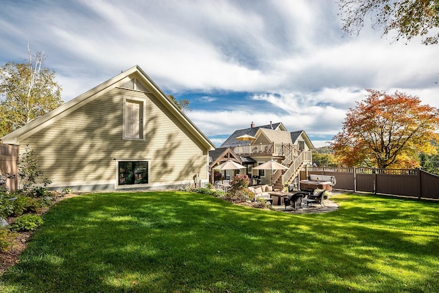 back of property featuring a yard and a patio area