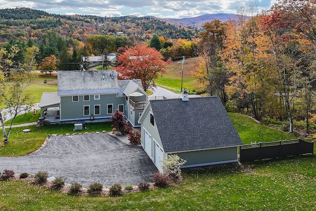 birds eye view of property with a mountain view