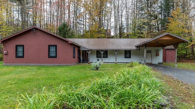 single story home with a carport and a front yard