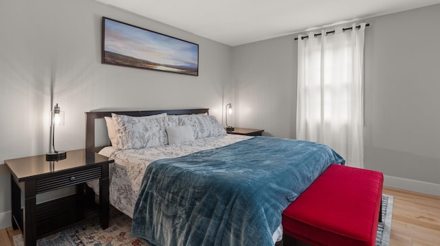 bedroom with hardwood / wood-style floors