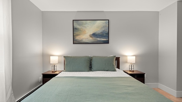 bedroom with light wood-type flooring