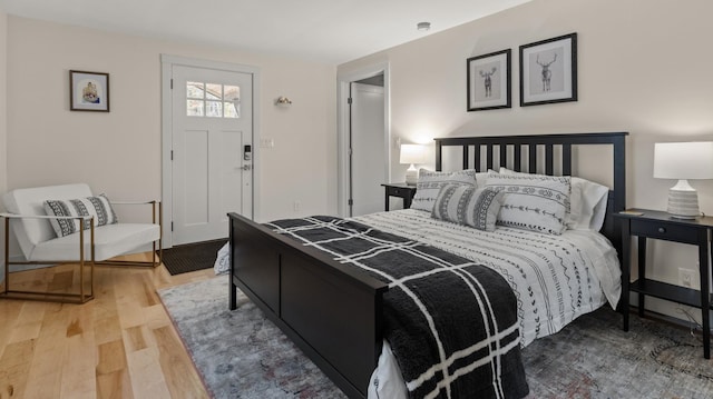 bedroom with hardwood / wood-style flooring