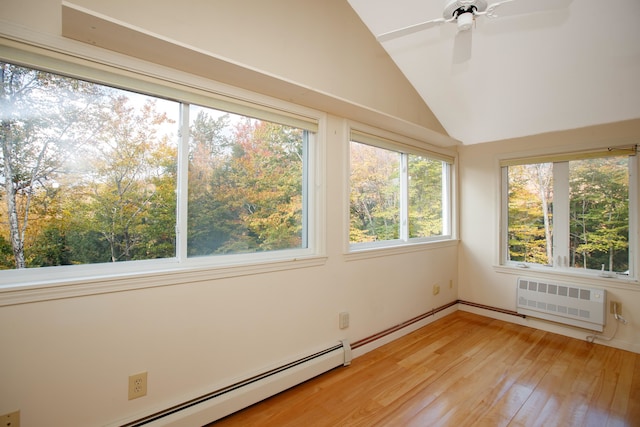 unfurnished sunroom with vaulted ceiling, radiator heating unit, ceiling fan, and a baseboard heating unit