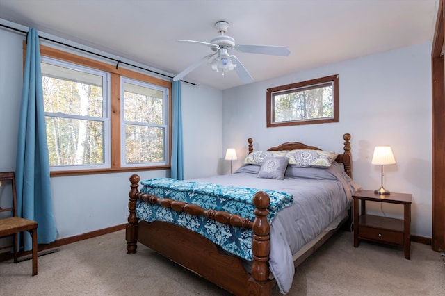 bedroom with light colored carpet and ceiling fan