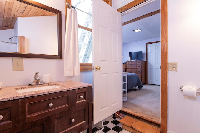 bathroom with curtained shower, vanity, and wooden ceiling