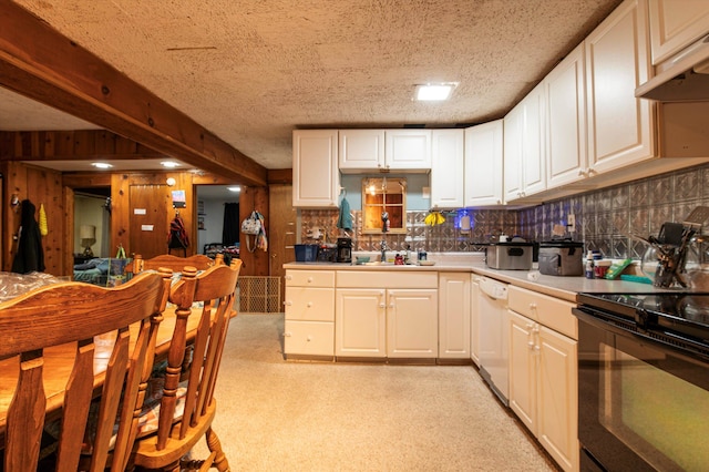 kitchen featuring black / electric stove, wooden walls, dishwasher, white cabinets, and exhaust hood