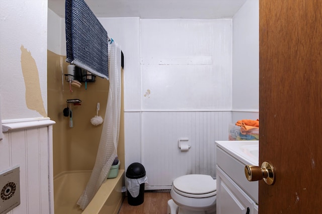 full bathroom with wood-type flooring, vanity, toilet, and shower / bath combo