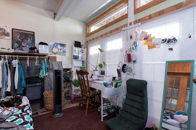 interior space with beamed ceiling and plenty of natural light