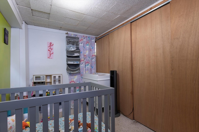 bedroom with a nursery area