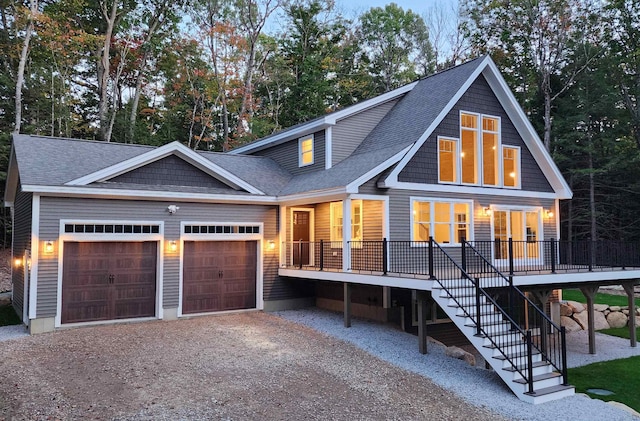 view of front of house featuring covered porch and a garage