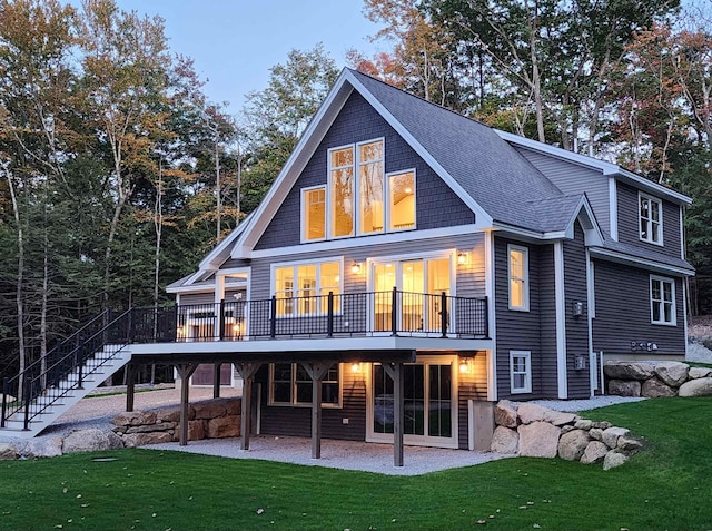 back of house with a yard, a patio, and a deck